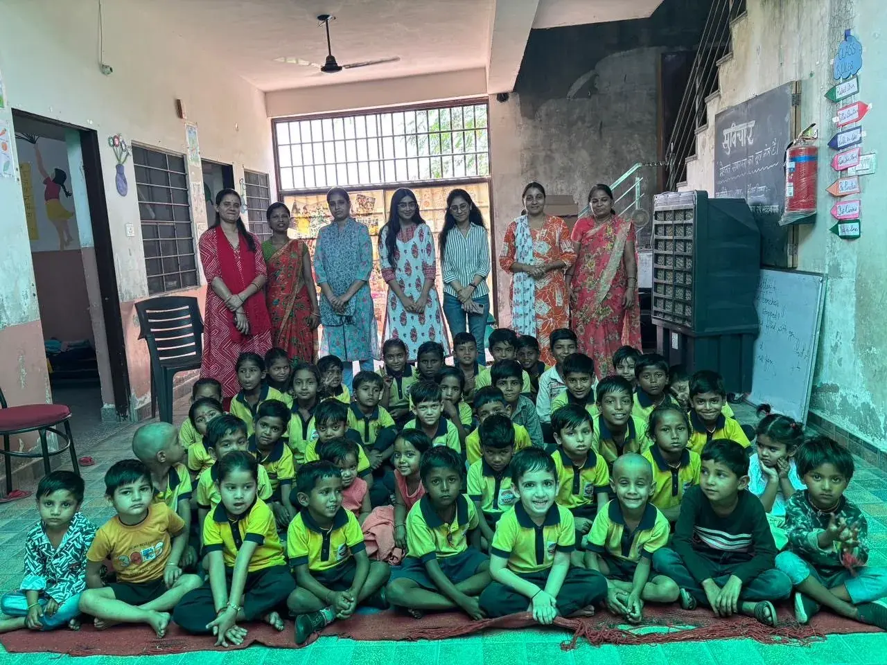 Children and teachers at a school screening camp run with Aignosis