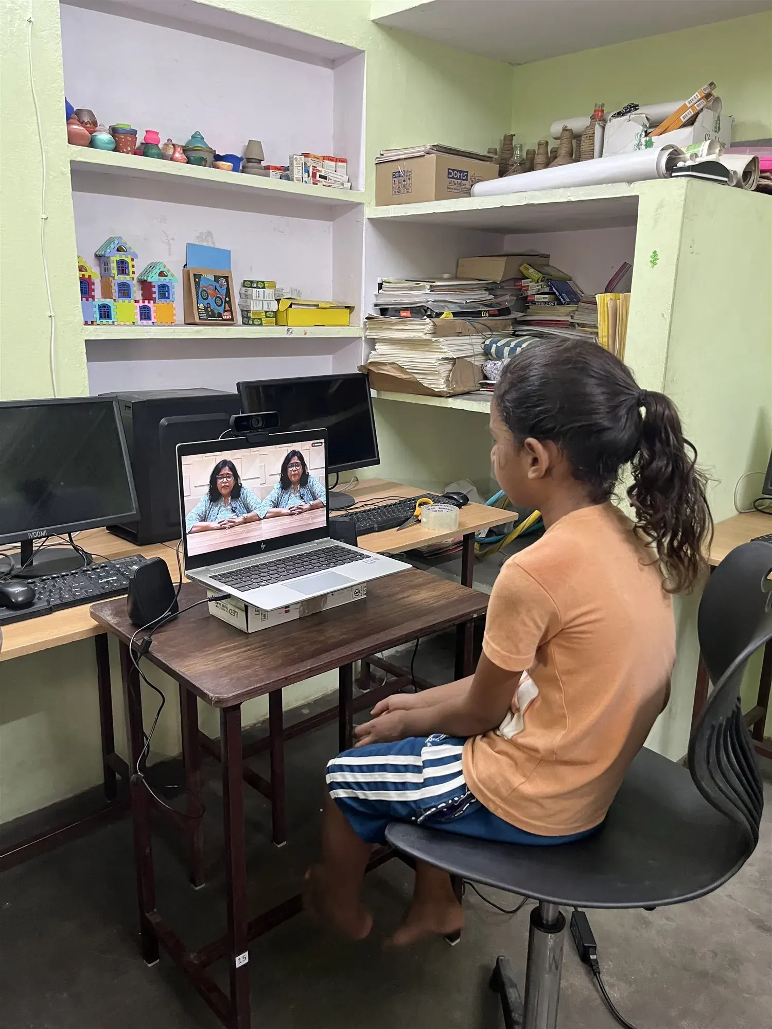 A child being screened at an Aignosis-enabled clinic workstation