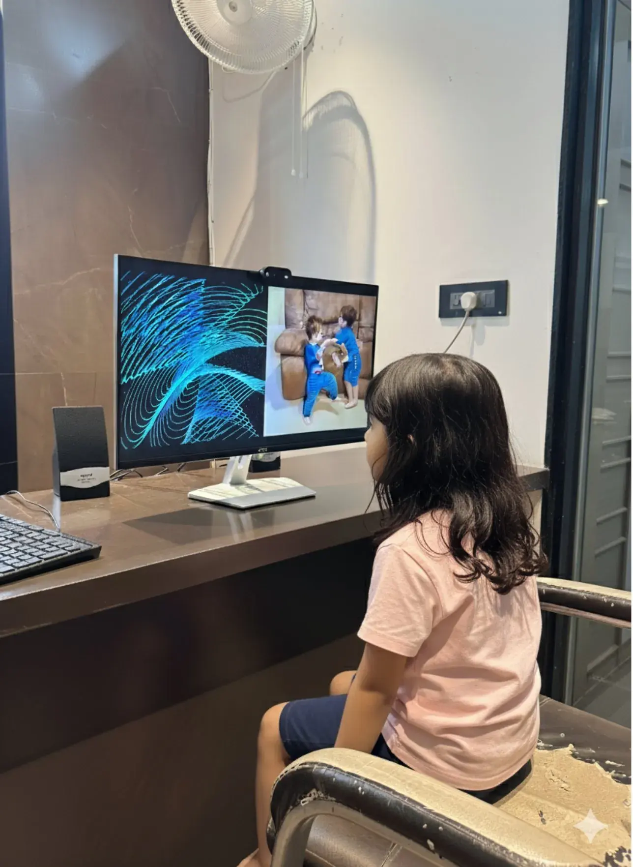 A child watching the screening video on a monitor